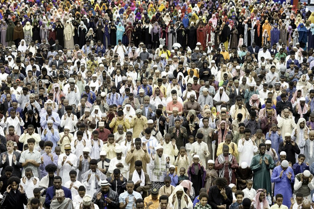 Muslims pray during Eid at the Androscoggin Bank Colisee in Lewiston. Photo by Daryn Slover/Lewiston Sun Journal.