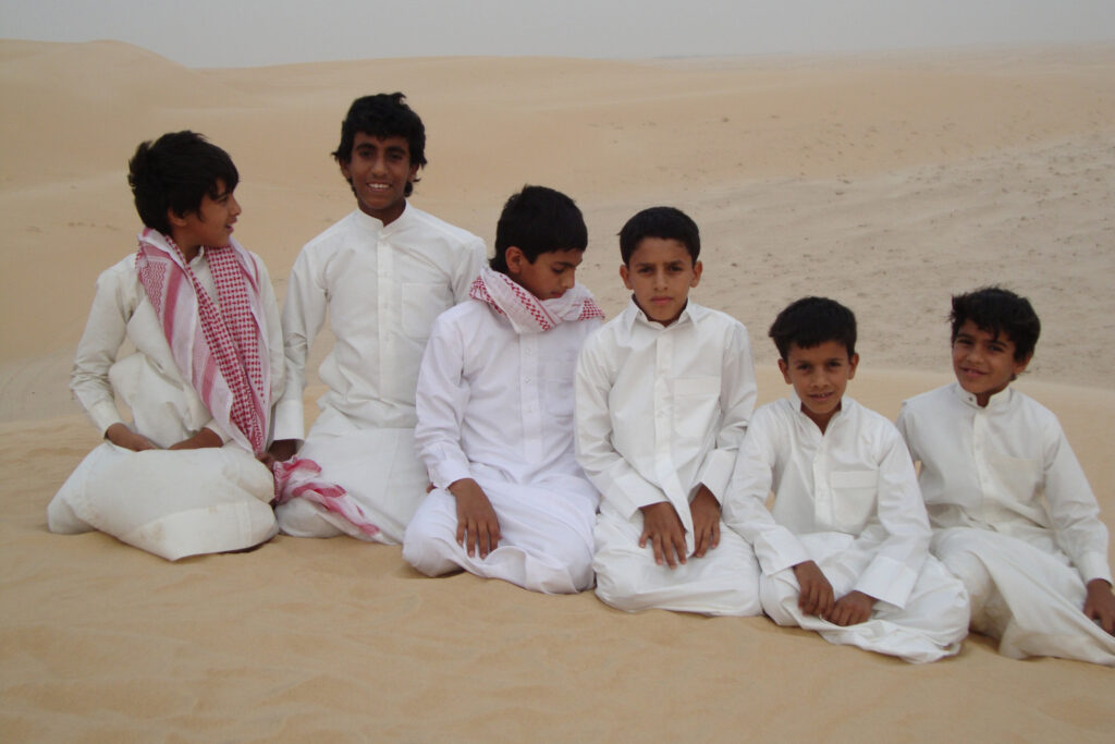 Saudi boys in the desert near Dhahran, Saudi Arabia. Photo by Loring Danforth.